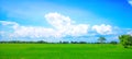 Beautiful blue sky and cloud background on sunshine day. Green fields Royalty Free Stock Photo