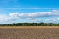 Beautiful blue sky with cloudscape over fields.