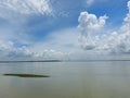 Beautiful blue sky with cotton like white cloud cool silently floating river Ganges