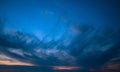 Beautiful blue sky with dark clouds. Sunset, evening, dramatic sky Royalty Free Stock Photo