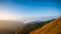 Beautiful blue sky and mountains in the mornings of summer.With dry meadows foreground