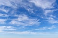 Beautiful blue sky over the sea with translucent, white, Cirrus clouds Royalty Free Stock Photo