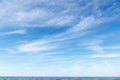 Beautiful blue sky over the sea with translucent, white, Cirrus clouds Royalty Free Stock Photo