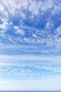 Beautiful blue sky over the sea with translucent, white, Cirrus clouds Royalty Free Stock Photo