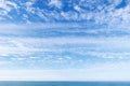 Beautiful blue sky over the sea with translucent, white, Cirrus clouds Royalty Free Stock Photo