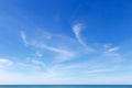 Beautiful blue sky over the sea with translucent, white, Cirrus clouds Royalty Free Stock Photo