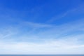 Beautiful blue sky over the sea with translucent, white, Cirrus clouds Royalty Free Stock Photo