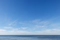 Beautiful blue sky over the sea with translucent, white, Cirrus clouds Royalty Free Stock Photo