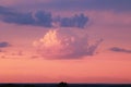 Beautiful blue sky with pink clouds illuminated by the setting sun. Sunset, evening, cumulus Royalty Free Stock Photo