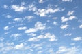 Beautiful blue sky with soft white clouds at bright sunny day as background