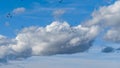 Beautiful blue sky with soft white clouds and flying ducks as an abstract background Royalty Free Stock Photo