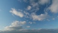 Beautiful blue sky with stratocumulus clouds background. Blue sky background with tiny clouds. Timelapse.