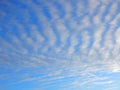 Beautiful blue sky with striped clouds