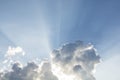 Beautiful blue sky with sunbeams and clouds. Sun rays through th Royalty Free Stock Photo