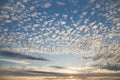 Beautiful blue sky at sunset with white cirrus, fluffy clouds Royalty Free Stock Photo