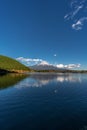 Beautiful blue sky at Tanuki Lake Tanukiko. Fuji mountain reflections, first snow in autumn season. Japan Royalty Free Stock Photo