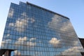 Blue sky and white clouds on windows of glass building Royalty Free Stock Photo