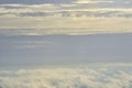 Beautiful blue sky with white puffy clouds in two levels with clear sky in between. Amazing view from airplane window taken up in Royalty Free Stock Photo