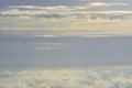 Beautiful blue sky with white puffy clouds in two levels with clear sky in between. Amazing view from airplane window taken up in Royalty Free Stock Photo