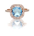 Beautiful Blue Topaz and diamond Rose Gold Halo Ring Royalty Free Stock Photo