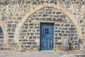 Beautiful blue traditional door in basalt wall