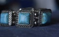 A beautiful blue turquoise is a silver bracelet decorated with turquoise placed Royalty Free Stock Photo