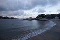 Beautiful blue twiligh scene of colombian tayrona national park beach with cloudy sky jungle mountains