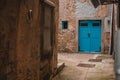 Beautiful blue wooden door in the picturesque city of Cres, Croatia. Beautiful narrow streets in the coastal city, corner and Royalty Free Stock Photo