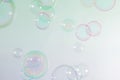 Beautiful blur transparent green and pink soap bubbles floating background.