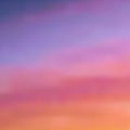 Beautiful blurred background in warm purple-pink and orange tones, sunset sky with light dusting of the clouds, gradient, vector Royalty Free Stock Photo