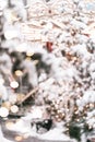 Beautiful blurred festive backround with merry-go-round and snowy fir trees in lights of traditional Christmas fair Royalty Free Stock Photo