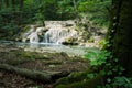 Beautiful blurred motion waterfall in the dark forest Royalty Free Stock Photo