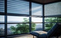 Beautiful blurred view background with a chair. Close-up of automated blinds, with view of the outdoors visible behind them. Royalty Free Stock Photo