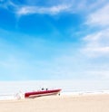 Beautiful boat on beach under blue sky and clouds Royalty Free Stock Photo