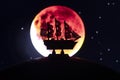 Beautiful boat toy over a blue balll with blurred red bloody moon eclipse scene at background Royalty Free Stock Photo