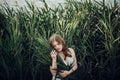 Beautiful boho girl embracing in grass at sunset light near lake Royalty Free Stock Photo