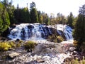 Beautiful Bond Falls in the Upper Peninsula of Michigan surrounded by fall foliage. Michigan Autumn Waterfall Scenery Royalty Free Stock Photo