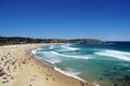 Beautiful Bondi Beach with people enjoying the sunny weather on the shore in Sydney, Australia