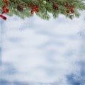 Christmas background with a border of fir branches, holly and cones. greeting card Royalty Free Stock Photo