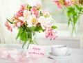 Beautiful bouquet of alstroemeria and cup of tea for mother's da