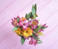 Beautiful bouquet of alstroemeria season on a pink wooden Royalty Free Stock Photo