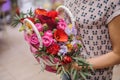 Beautiful bouquet of bright flower basket in hands Royalty Free Stock Photo