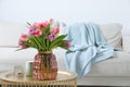 Beautiful bouquet of colorful tulip flowers on coffee table in room, space for text Royalty Free Stock Photo