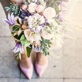 Beautiful bouquet with delicate flowers. Pink-white-purple bouquet. Bridal bouquet in female hands