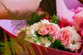 Beautiful bouquet of delicate flowers in a pink wrap, close-up Royalty Free Stock Photo