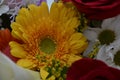 Beautiful bouquet of flowers in bright colors. It consists of roses, gerberas and decorative grass.
