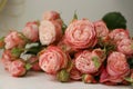 Beautiful bouquet of flowers pink roses on white wooden background Royalty Free Stock Photo