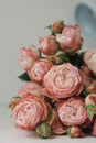 Beautiful bouquet of flowers pink roses on white wooden background Royalty Free Stock Photo