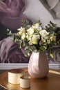 Bouquet of flowers on table in room. Stylish interior design Royalty Free Stock Photo