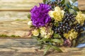 Beautiful bouquet of flowers on a wooden background.